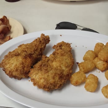 Clenney's Grill - Chicken strip platter with tater tots and a side of pork jowl. - American Near Me - Milan, Tennessee Clenney's Grill - Chicken strip platter with tater tots and a side of pork jowl. - American Near Me - Milan, Tennessee