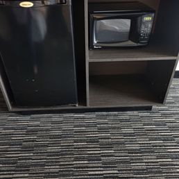 The TV sits on the fridge and microwave. No drawers. The TV sits on the fridge and microwave. No drawers.