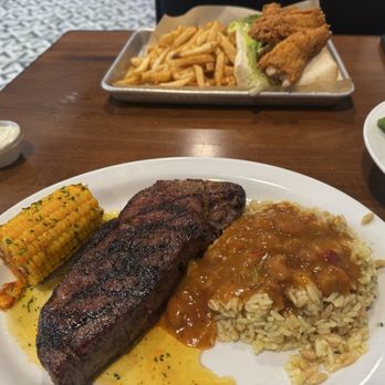 Port 17 - NY Strip with some Cajun corn and rice pia - Seafood Near Me - Biloxi, Mississippi Port 17 - NY Strip with some Cajun corn and rice pia - Seafood Near Me - Biloxi, Mississippi