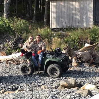 Moose Trail ATV Adventures - Posing in front of a small cabin by the beach - ATV Rentals/Tours Near Me Moose Trail ATV Adventures - Posing in front of a small cabin by the beach - ATV Rentals/Tours Near Me