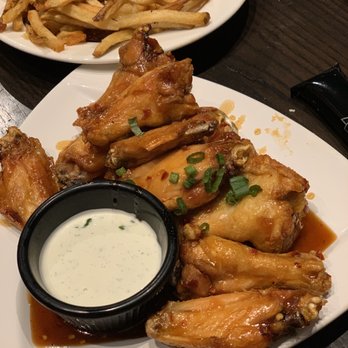 Local Goat - Sticky Glazed chicken wings. Great flavor with delayed medium heat. - New American Near Me - Pigeon Forge, Tennessee Local Goat - Sticky Glazed chicken wings. Great flavor with delayed medium heat. - New American Near Me - Pigeon Forge, Tennessee