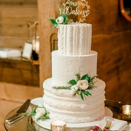 a wedding cake on a barrel a wedding cake on a barrel
