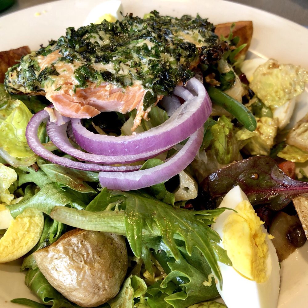 Delicious salmon Niçoise salad (bite missing) Delicious salmon Niçoise salad (bite missing)