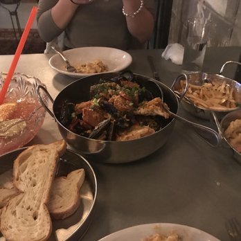 Bootleg Special - hurricane bowl and boil to the left; dishes to the right are the garlic fries and the crawfish mac and cheese - Seafood Near Me - Boston, Massachusetts