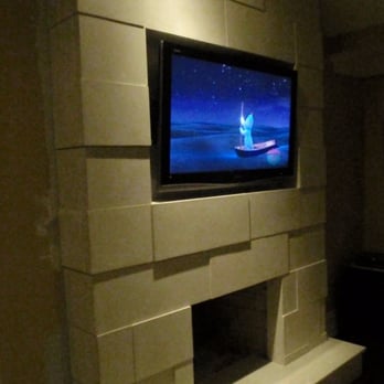 Mag's Concrete Works - a flat screen tv mounted above a fireplace - General Contractors Near Me - Oakville, Ontario Mag's Concrete Works - a flat screen tv mounted above a fireplace - General Contractors Near Me - Oakville, Ontario