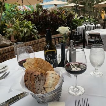 Michael's On East - Assorted Breads, Butter and Red Wine - New American Near Me - Sarasota, Florida Michael's On East - Assorted Breads, Butter and Red Wine - New American Near Me - Sarasota, Florida