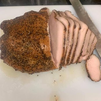 Grumpy's Backyard BBQ - sliced pork on a cutting board - Food Trucks Near Me Grumpy's Backyard BBQ - sliced pork on a cutting board - Food Trucks Near Me