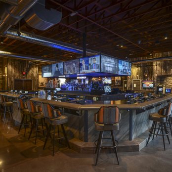 PT's Gold - a bar with a lot of chairs - Sports Bars Near Me - Henderson, Nevada