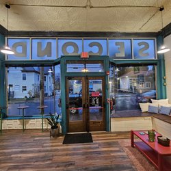 Second Cafe - The front of the building is seen from inside on a rainy morning.