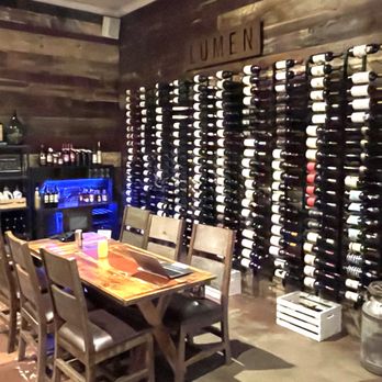 Lumen Wines - Lumen's "Wall of Wines". I've never seen anyone inside the wine room or at the table doing a tasting. - Wine Tasting Room Near Me - Los Alamos, California