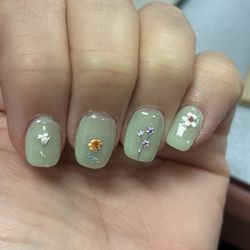Classy Nails & Spa - Flower stickers on jade color.