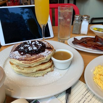 Clinton St. Baking - full spread: Pancakes, Sugar Cured Bacon, 2 Eggs Any Style, Mimosa - Bakeries Near Me - New York, New York Clinton St. Baking - full spread: Pancakes, Sugar Cured Bacon, 2 Eggs Any Style, Mimosa - Bakeries Near Me - New York, New York