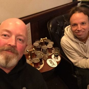 Canterbury AleWorks - two men sitting at a table with beers - Breweries Near Me - Canterbury, New Hampshire Canterbury AleWorks - two men sitting at a table with beers - Breweries Near Me - Canterbury, New Hampshire