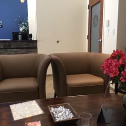 Hand & Stone Massage and Facial Spa - Lobby with fresh flowers and Hershey's kisses