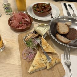 Restaurant Ringgenberg - Tapas - jamon (left), sun dried tomatoes with olives (top), and sardines (bottom)