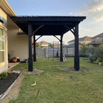 Whatcha Need - a backyard with a pergol roof - General Contractors Near Me