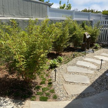 San Agustin Landscape - Serene walkway in back with bamboo and water feature. - Irrigation Near Me San Agustin Landscape - Serene walkway in back with bamboo and water feature. - Irrigation Near Me