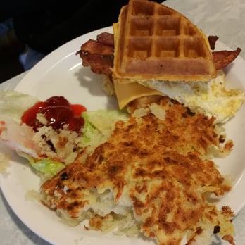 Masters Pancake House - Waffle sandwich with bacon, cheddar and egg. It had a side of strawberry preserve and hash browns. Love how it not greasy!!! - Pancakes Near Me - Chicago, Illinois