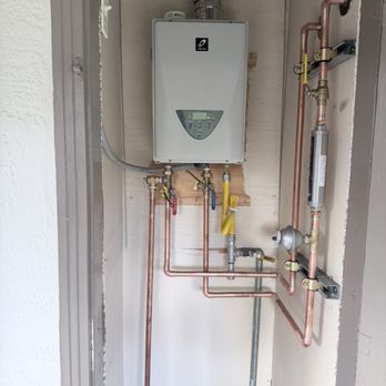 Crown Plumbing - Indoor of tankless water heater. - Plumbing Near Me - San Jose, California Crown Plumbing - Indoor of tankless water heater. - Plumbing Near Me - San Jose, California