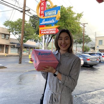 Leonard's Bakery - Iconic pink box in front of iconic Leonard's sign - Bakeries Near Me - Honolulu, Hawaii Leonard's Bakery - Iconic pink box in front of iconic Leonard's sign - Bakeries Near Me - Honolulu, Hawaii