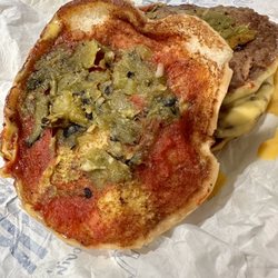 McDonald's - They add green chiles to their burgers! Thanks for letting me know Van!