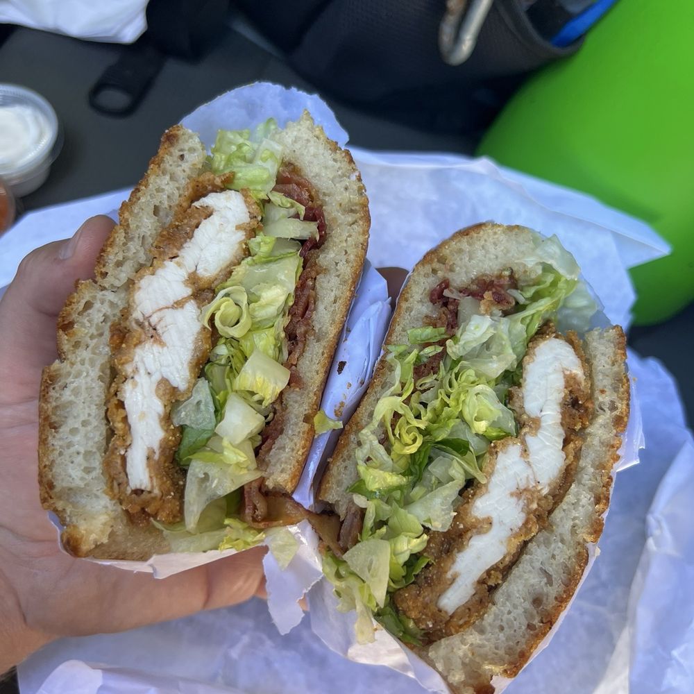 Hometown Bakeshop - The little neck sandwich. Fried chicken cutlet, bacon and lettuce on homemade focaccia bread - Bakeries Near Me - Centerport, New York