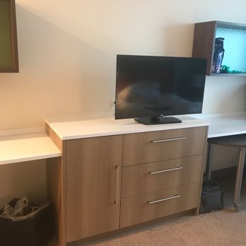 Home2 Suites by Hilton Gilbert - Tv area between work station and dining table area. - Hotels Near Me - Gilbert, Arizona