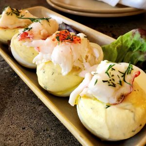 Photo of Monkeypod Kitchen - Lahaina, HI, United States. Lobster deviled eggs taste even better during happy hour with 50% off ($9.00)