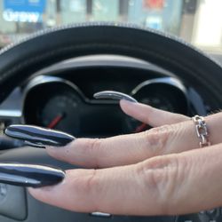 The curved nail he placed on my pinky. Does not match the shape or length of other nails.