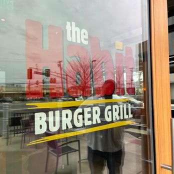 Habit Burger & Grill - a man standing in front of a window - Burgers Near Me - Cherry Hills, New Jersey