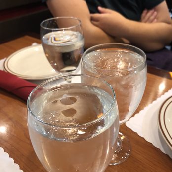 Guras Spice House - Filling the already full water. (Upper left most glass was original fill. Other are the "refill". More like a literal "top off" haha. - Indian Near Me - Herriman, Utah