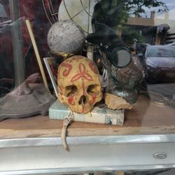 D Haberdashery - Real human skull with paint designs in the front store window along with a steam punk mannequin head.