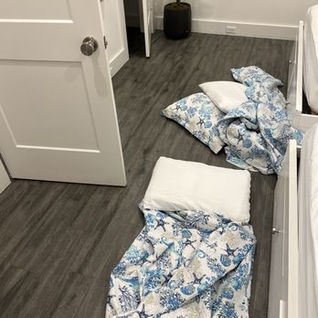 BeachBox Vacation Rentals - Bed linen just thrown in the floor upon arrival - Vacation Rentals Near Me - Galveston, Texas