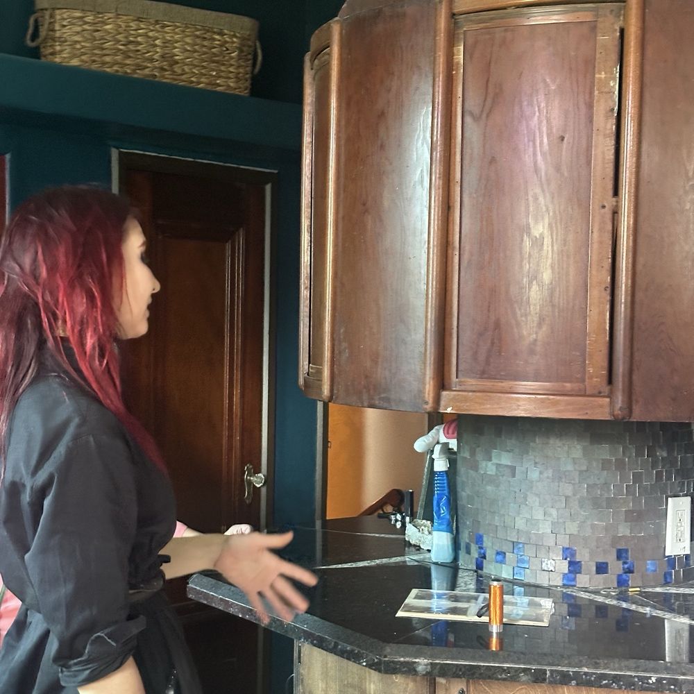The Wonder House - Kristen is showing the original lazy Susan kitchen cabinet. - Landmarks & Historical Buildings Near Me - Bartow, Florida