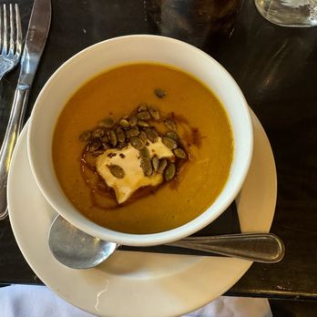 Russell House Tavern - Squash soup with pumpkin seeds, dollop of sour cream and balsamic glaze drizzle - New American Near Me - Cambridge, Massachusetts Russell House Tavern - Squash soup with pumpkin seeds, dollop of sour cream and balsamic glaze drizzle - New American Near Me - Cambridge, Massachusetts