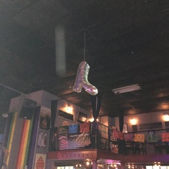 SA Country Saloon - a woman hanging from the ceiling - Gay Bars Near Me - San Antonio, Texas