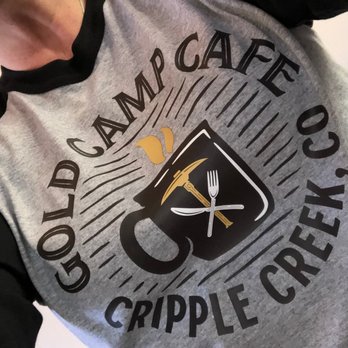 Gold Camp Cafe - a woman holding a cup of coffee - Cafes Near Me - Cripple Creek, Colorado Gold Camp Cafe - a woman holding a cup of coffee - Cafes Near Me - Cripple Creek, Colorado
