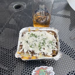 Carne Asada half order potato with a lawnmower beer, amazing combination