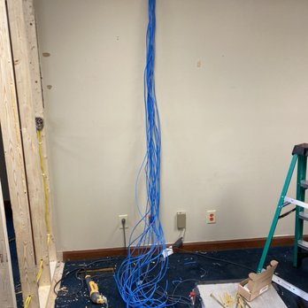 HollisServices - Running network cable for a realty business. After completion will have a 24 port patch panel and switch on the wall - IT Services & Computer Repair Near Me - Hampstead, North Carolina