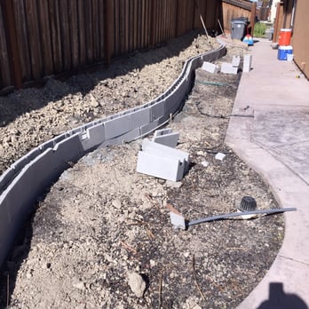 Nine Orange Landscaping - Curvy retaining being laid out - Landscaping Near Me