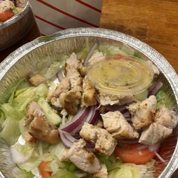 a chicken salad with lettuce and tomatoes