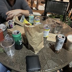 Several beers, chicken sandwiches and a frozen coffee slush