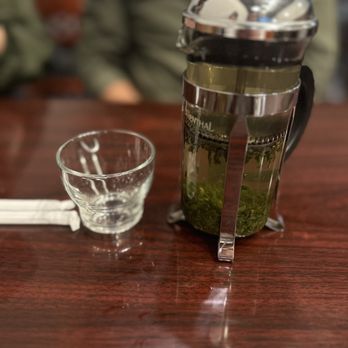 Pho 22 - a glass of water next to a french press - Vietnamese Near Me - Montrose, California