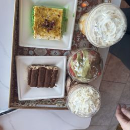 Dubai Cup, Caramel and mocha Frappuccinos, tiramisu and a pistachio milk cake Dubai Cup, Caramel and mocha Frappuccinos, tiramisu and a pistachio milk cake