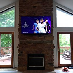 The Theater People - TV mounted over a fireplace with wires hidden