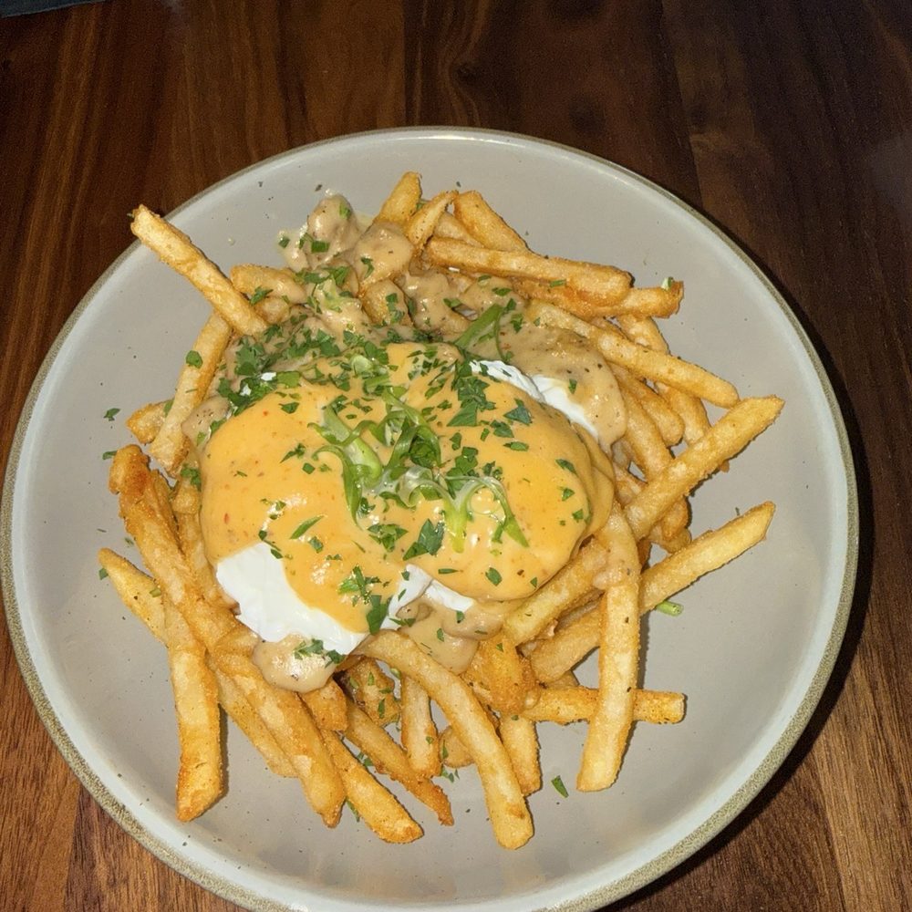 VINYL - Poached egg poutine - New American Near Me - Charlotte, North Carolina VINYL - Poached egg poutine - New American Near Me - Charlotte, North Carolina