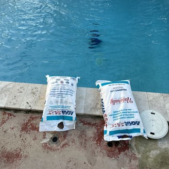 Kienzler Pool Services - Adding salt to keep salt level in good condition - Pool Cleaners Near Me