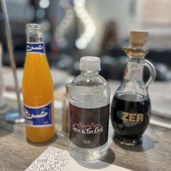 Spice and Fire Grill - Orange soda, S&FG Bottled water and their delicious Pomegranate Sour sauce!