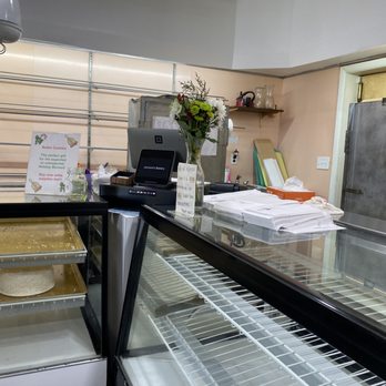 Jackson's Bakery - a counter with a glass display case - Bakeries Near Me - Rochester, New York