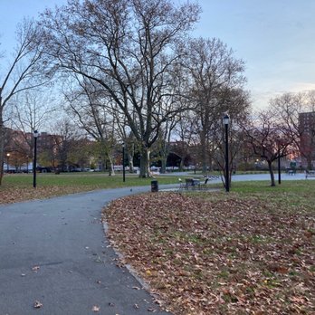 Coffey Park - A park with leafless trees, benches, and a paved path, captured during late autumn or early winter, with fallen leaves on the ground. - Parks Near Me - Brooklyn, New York